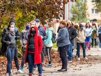 Queue of people wearing masks